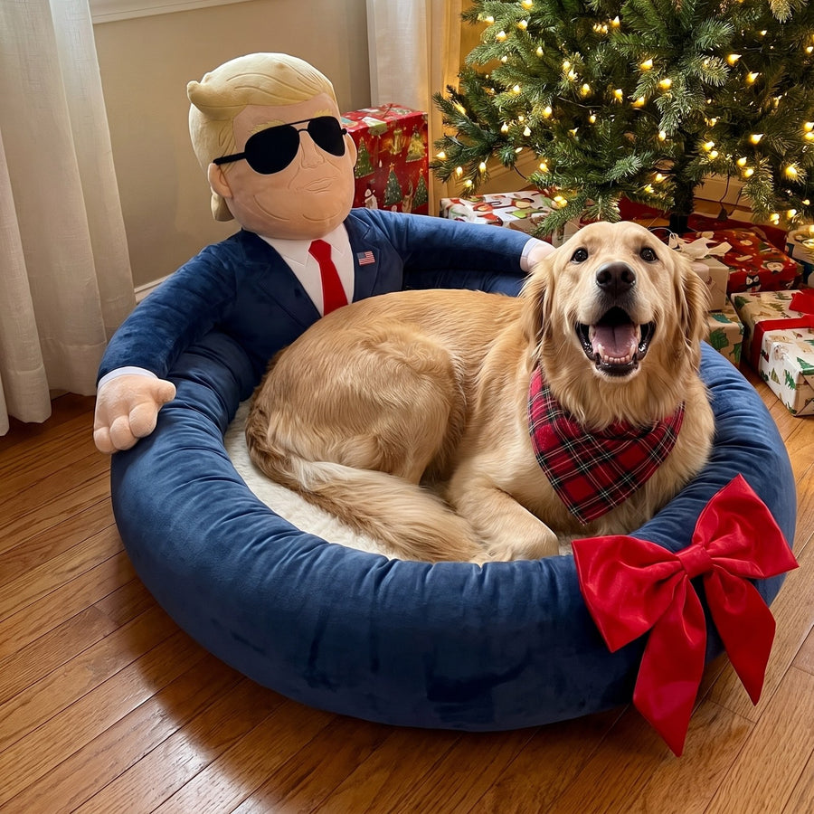 Golden retriever in the First Dog Bed with a red bow under the Christmas tree